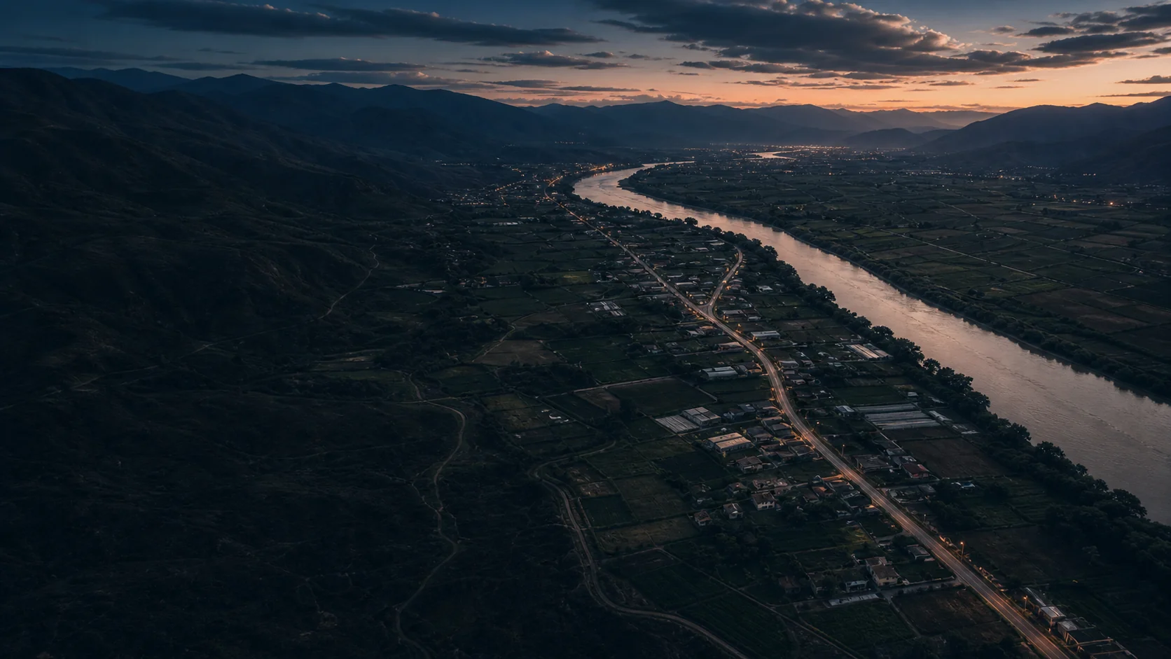Vista territorial de un valle andino con río, caminos y áreas productivas